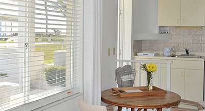 kitchen table and kitchen area looking out the window